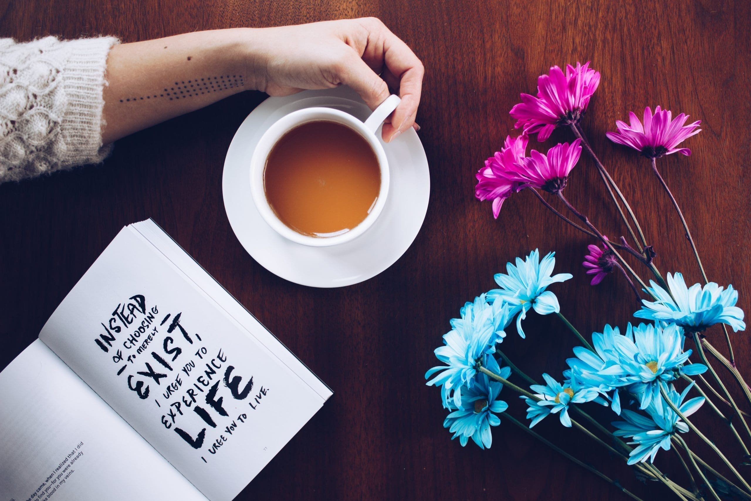 Tea with Open Book and Flowers