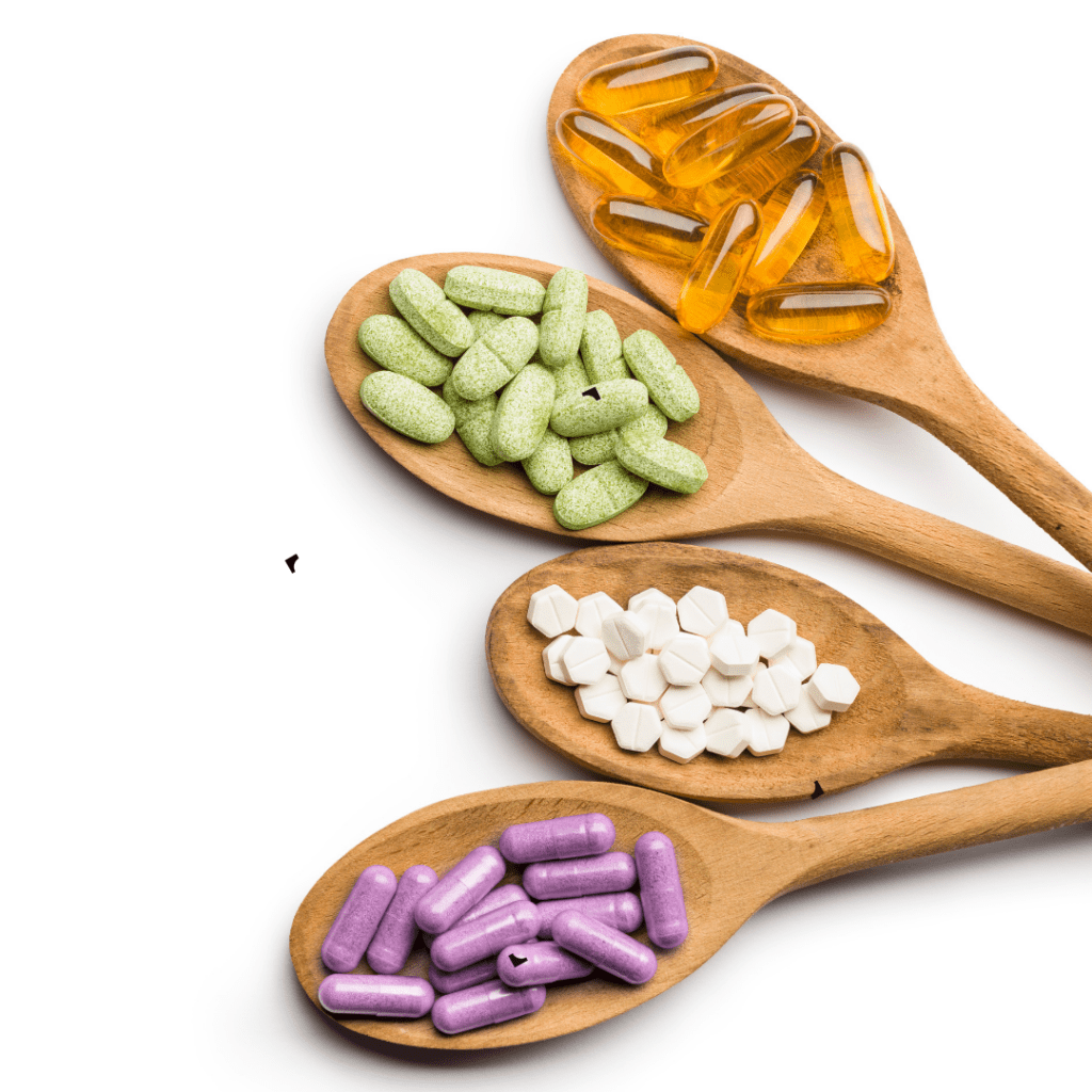 Image of supplements on wooden spoons